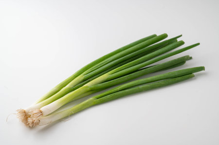 isolated bunch of scallion on white backgroundの写真素材