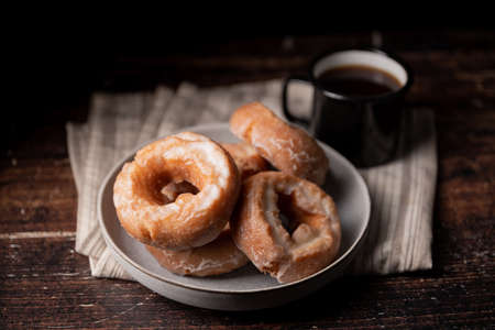 glazed old fashioned style doughnut on dark backgroundの写真素材