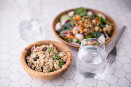 glass of mineral water and healthy salad