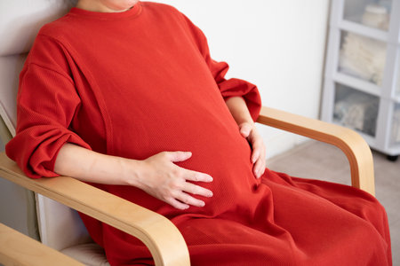 asian pregnant women sitting on the chairの写真素材