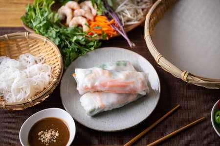 vietnamese spring rolls with ingredientsの写真素材