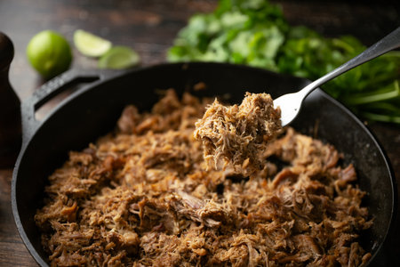 carnitas in skillet pan with tacos ingredientsの写真素材