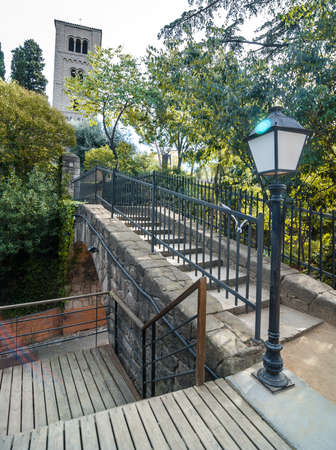 Walkway through treed parks and gardens in older, inner villages of Seaside Barcelona, Spain.の写真素材