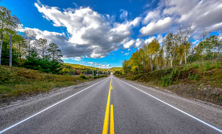 Highway to anywhere - bright summer day on country roads.の写真素材