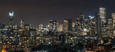 Urban lighted landscape of Toronto.   A balcony view of  lighted streets, parks, buildings and office towers on a hot & humid August night in capitol of Ontario, Canada,のeditorial素材