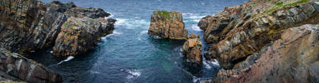 Huge rock & boulder outcrops along Cape Bonavista coastline in Newfoundland, Canada.   Coastal...