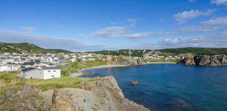 View of the town of Crow Head proper.   Small community as seen from atop a local high point by turning around, facing the village, Newfoundland, Canada.の写真素材