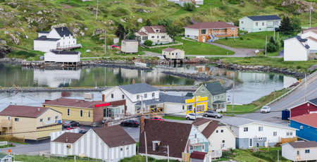 Small village and community buildings in Twillingate, Newfoundland.  Homes along shoreline in this coastal village, local roads connect the community along the Island's edges.の写真素材