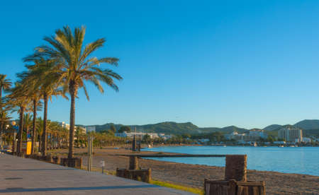 Golden sunset on the beach & marina in St Antoni de Portmany, Ibiza, Spain.の写真素材