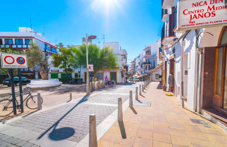 Sant Antoni De Portmany, Ibiza, November 6th, 2013:   Tourism in Spain.  Bright sunshine on in town of Ibiza in the off-season.  Very bright and colorful street & shops.のeditorial素材