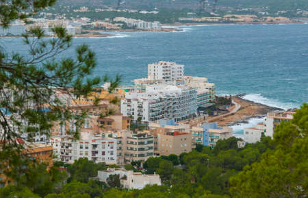 View from the hills in St Antoni de Portmany & surrounding area in Ibiza.  Clearing November day in the bay.  Islands near Spain.  Hotels along the beach, places to stay.の写真素材