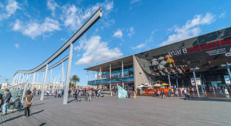 Port Vell, Barcelona, Spain, Nov 3rd, 2013:   Tourism in Spain, people visit a shopping centre in la...
