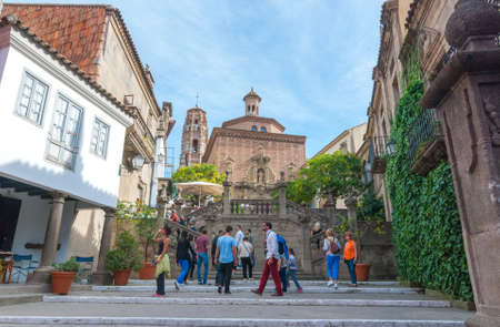 Barcelona, Spain, Nov 2, 2013: Tourists climb steps in charming Barceloneta.  18th century purpose built city in city, Barcelona proper to   accommodate displaced neighbourhood of citizens in that era.のeditorial素材