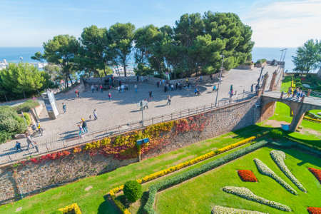 Barcelona, Spain, Nov 3rd, 2013:   People visit old fort Montju Castle in Barcelona.  16th century military fortress in is now municipal facility atop of Montju hill near Balearic Sea in Spain.のeditorial素材