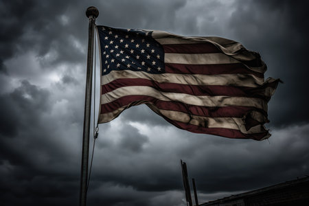 American flag in stormy sky. Black and white image with shallow depth of field.の素材