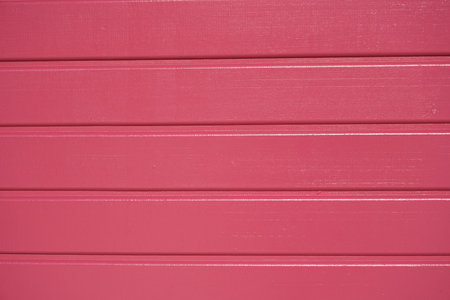 Pink painted wooden wall background or texture. Close-up image.