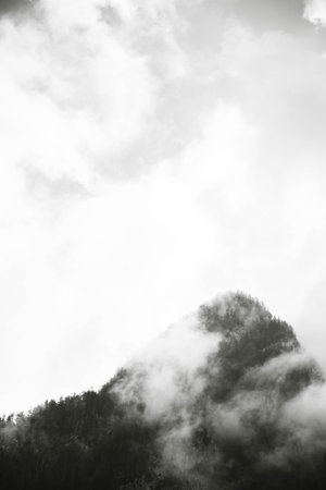 Clouds in the mountains. Black and white image of clouds in the mountains.の写真素材