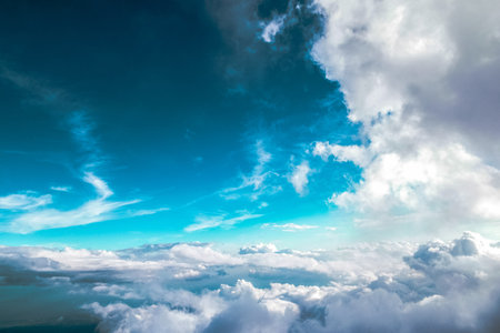 Blue sky with white clouds. View from airplane window. Nature background