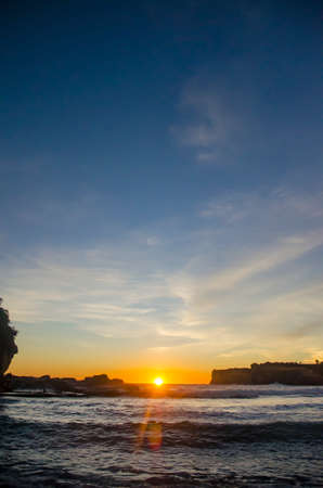 sunset on the beach in Klayar Beach, Pacitan, East Javaの写真素材