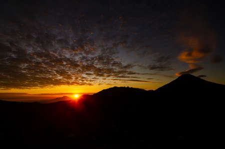 Sunrise in the mountains of Prau, Dieng, Wonosobo, Central Javaの写真素材