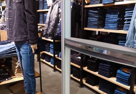 Blue denim jeans. Collection of stacked jeans, manikin in a denim suit.の写真素材