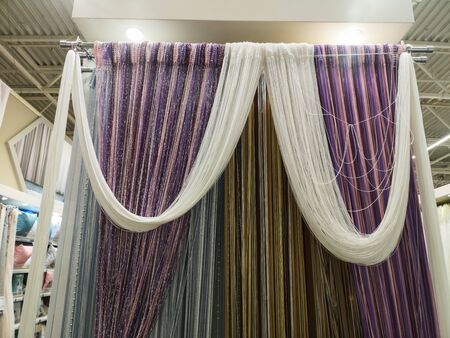 Kissa curtains with different colors and backlights are sold at the mall.の写真素材