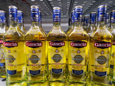 Vermouth Gancia Bianco in glass bottles on the counter in Metro AG hypermarket January 20, 2020 in Russia, Kazan, Tikhoretskaya Street 4.のeditorial素材