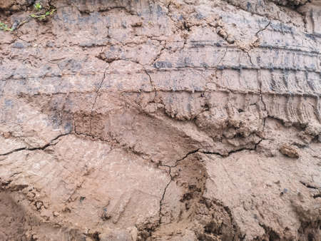 textured car track in the mud. template for a site from the ground.の写真素材