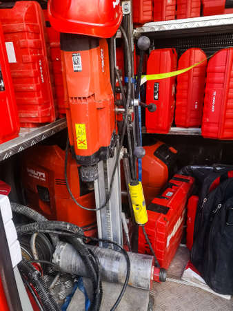 a diamond drilling rig with a motor and a drill of the Hilti Corporation company for drilling holes...