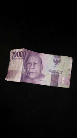 Rupiah banknote design. Indonesian rupiah currency isolated on a black background.の写真素材