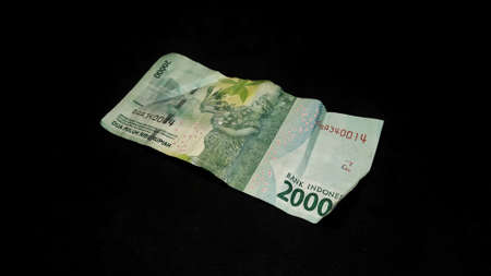 Rupiah banknote design. Indonesian rupiah currency isolated on a black background.の写真素材