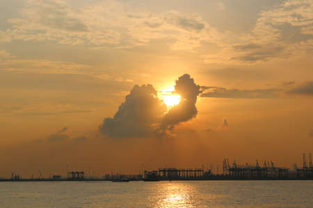 A sunset view with a busy harbor in the backgroundの写真素材