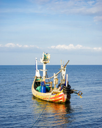Fishing boat in the sea. Indonesia. Blue sky background.の写真素材