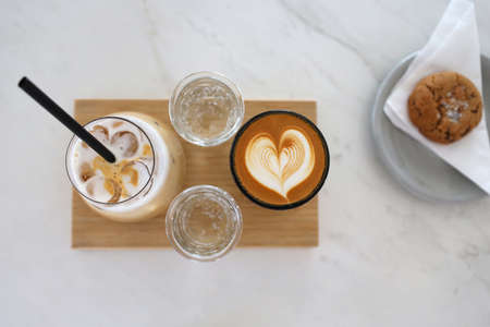 coffee ice coffee with cookies latte cappuccino beans heart girl with sweets Dubai UAE Arab coffee water pool sea view pool view with cafeの写真素材