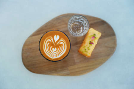 coffee ice coffee with cookies latte cappuccino beans heart girl with sweets Dubai UAE Arab coffee water pool sea view pool view with cafeの写真素材