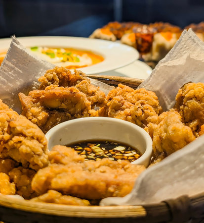 A generous serving of golden-brown, crispy Asian fried chicken, reminiscent of Japanese Karaage or...