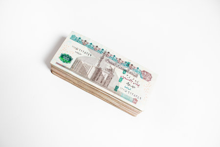Egyptian money bundles of currency 100 pound isolated on white Backgroundの写真素材