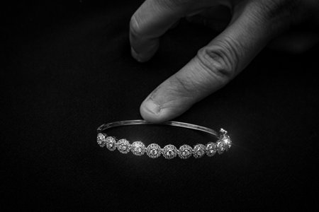 A beautifully crafted white gold bracelet featuring intricate diamond embellishments. This luxurious...