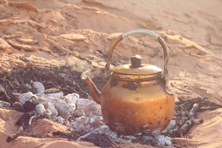 Kettle on the fire in the desert. The concept of camping in the desert.の写真素材
