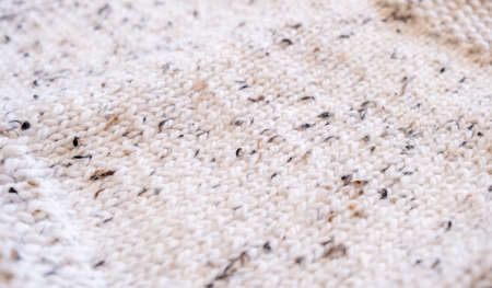 Handmade knitted woolen fabric texture background. Close up.の写真素材