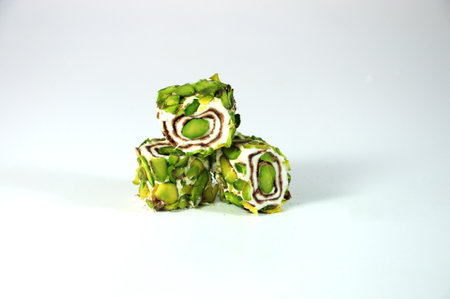 Traditional Turkish delight with pistachios on a white background. selective focus.の写真素材