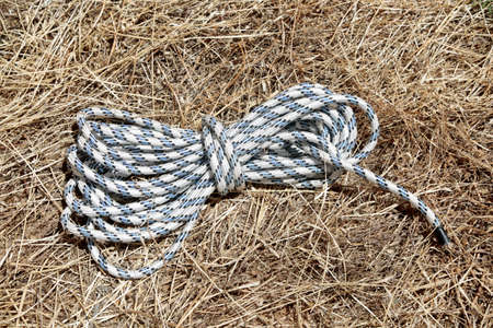 A tether found on dry grass