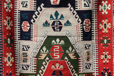 An example from Turkish carpet weaving art. Textures and patterns in color from woven carpets.