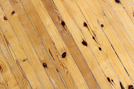 Wooden floor covering. Cross-mounted wooden paneling. Floor covering of the room. For backgrounds.の写真素材