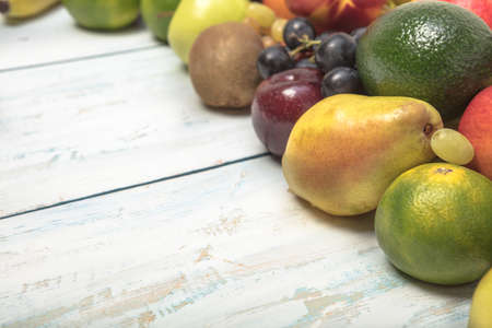 Healthy fruit background ; Studio photo of different fruits on white and  blue  vintage wooden table , high resolution productの写真素材