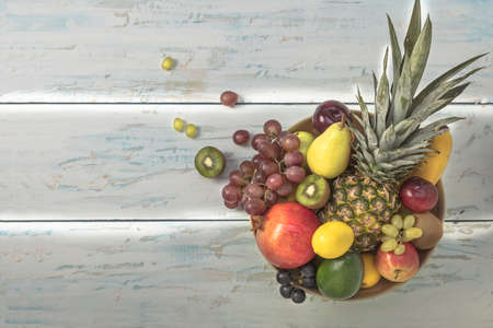 Healthy fruit background ; Studio photo of different fruits on white and  blue  vintage wooden table , high resolution productの写真素材
