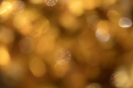 Golden yellow bokeh light defocused abstract  background  with copy spaceの写真素材