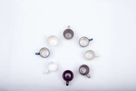 Eight empty coffee cups arranged in round pattern, isolated on white background with copy spaceの写真素材