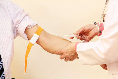 Doctor are vaccinations to patient. To prevent diseases that are prevalent. closed-up of hand with vaccine shot.の写真素材