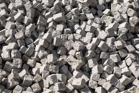 Granite cobblestone texture. Granite cobblestone pavement background. Abstract background of cobblestoneの写真素材